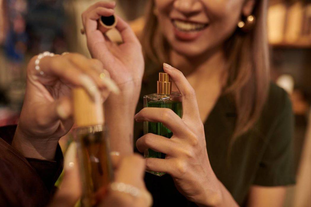 Woman Spraying Perfume on Wrist