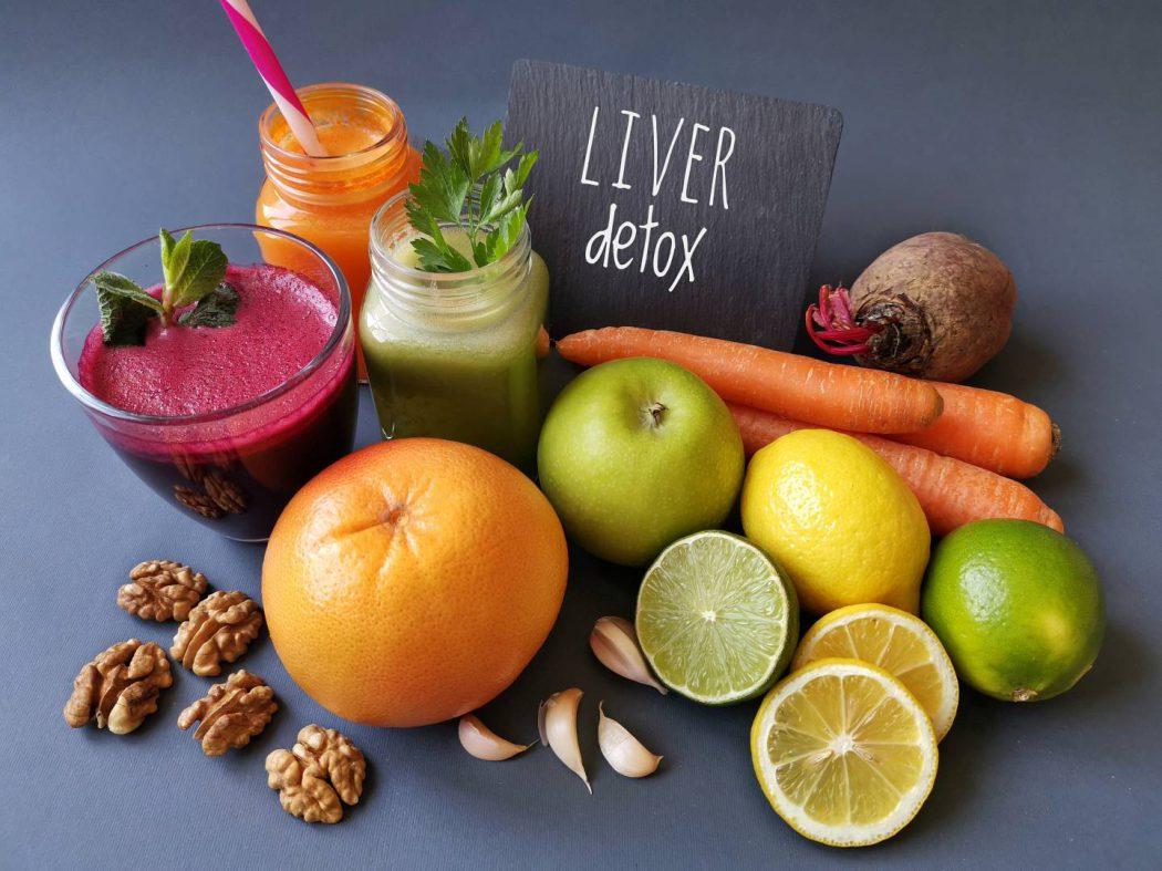 Liver detox juice in a glass jar with ingredients. Fresh smoothi