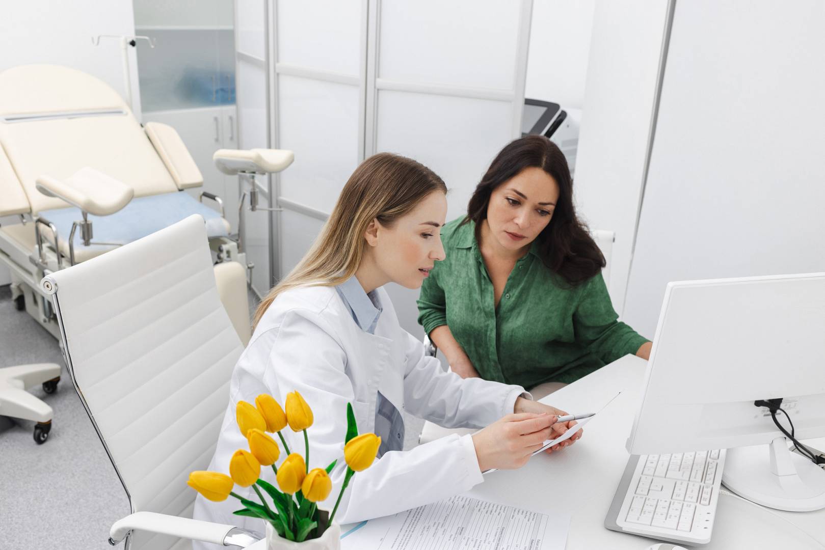 Consultation of gynecologist. Doctor and woman patient is talking in gynecological office during visit at gynecology clinic