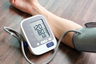 Doctor woman check blood pressure monitor and heart rate monitor
